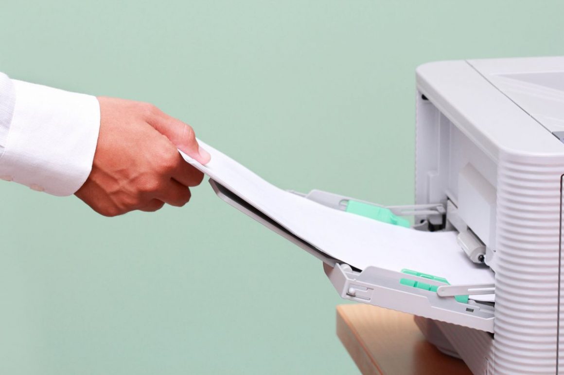 businessman-working-with-printer